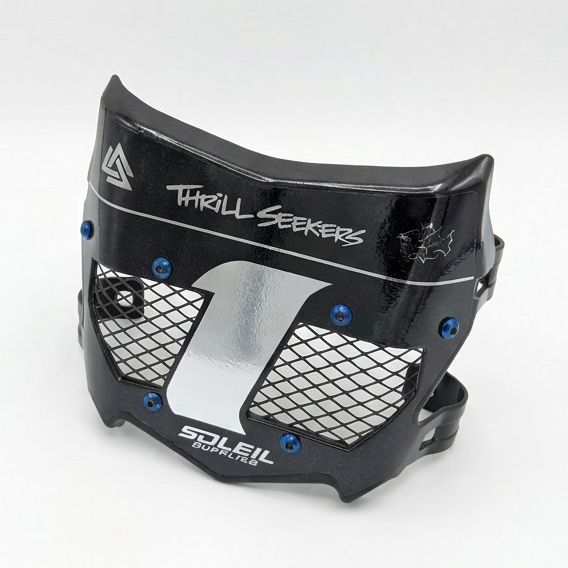 A black motorcycle or ATV face shield with a silver mesh grille and blue screws, featuring &