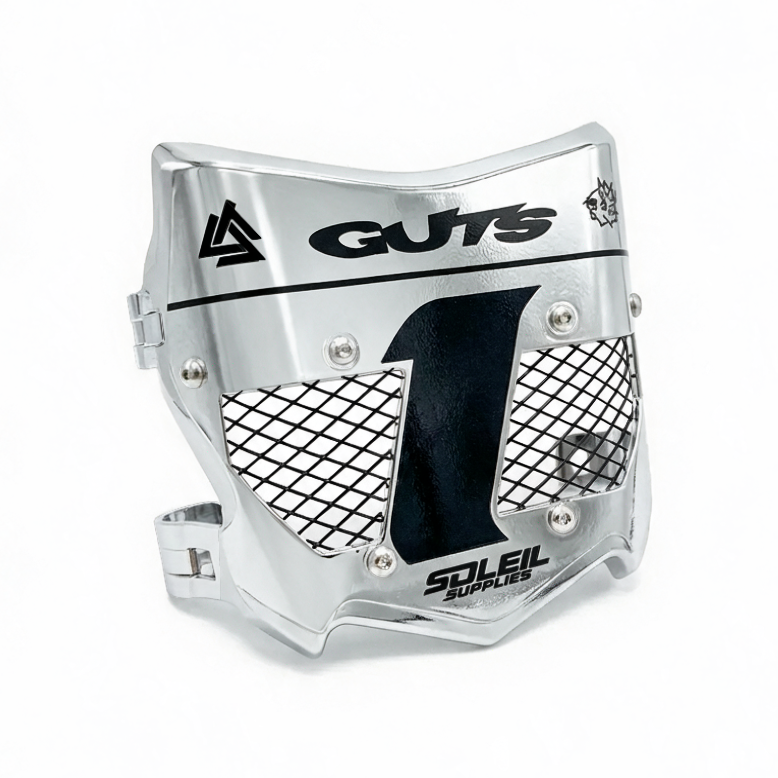 A silver metallic motocross face guard with black mesh panels and printed black branding, including &