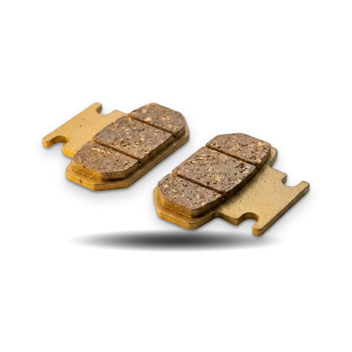 Two brake pads on a beige background with &