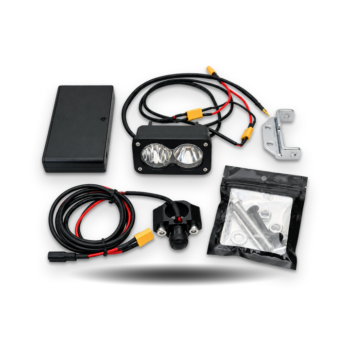 Tuttio Baja full light kit with chrome bracket, battery pack, wiring and hardware on white