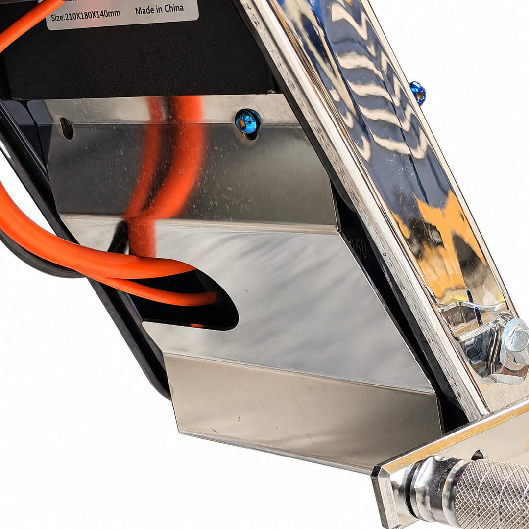 Tuttio upgraded bash guard installed with orange motor wires passing through the wire clearance opening