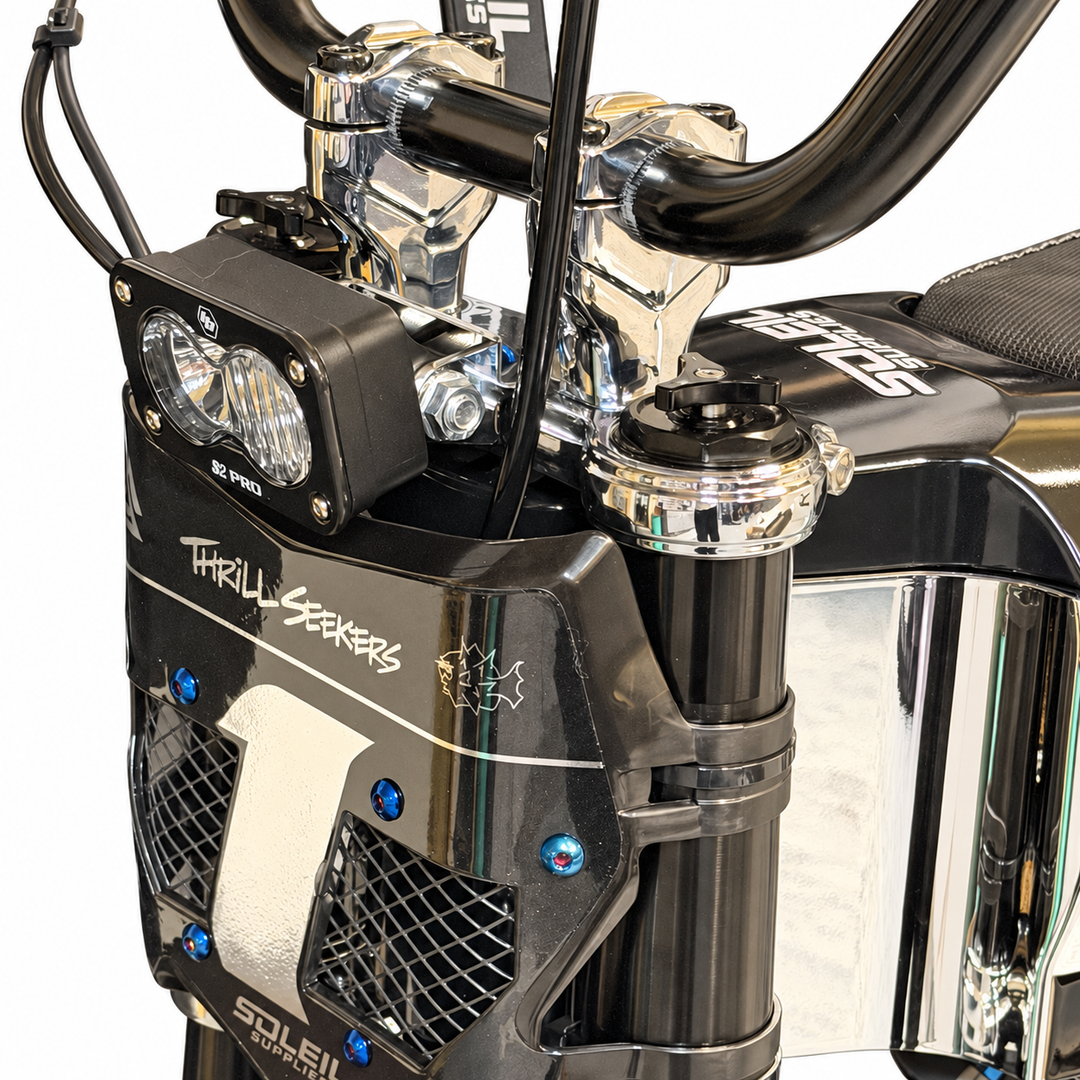 Tuttio chrome triple clamps installed on the bike, front three-quarter view on white